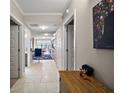 Bright hallway with tile floors and access to living areas at 16300 County Road 455 # 511, Montverde, FL 34756