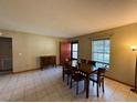Inviting dining room with wood table, tile floors, and natural light at 1805 Ne 29Th Pl, Ocala, FL 34479