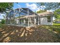 Spacious screened-in pool enclosure offering relaxation and entertainment in a private backyard setting at 1860 Park Forest Blvd, Mount Dora, FL 32757