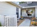 Inviting front porch with rocking chairs, decorative plants, and a peaceful ambiance at 106 Baytree Blvd, Tavares, FL 32778