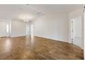 Bright and airy living room showcasing vaulted ceilings and ample space at 1409 Gatlin Pl, The Villages, FL 32163