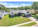 An aerial view of a single Gathering home with mature landscaping and a manicured front lawn at 1761 Country Terrace Ln, Apopka, FL 32703