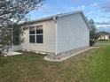This home features low-maintenance vinyl siding and a well-kept yard with tasteful landscaping at 1812 Sanibel Ct, The Villages, FL 32162