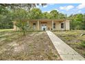 Ranch-style home with a columned front porch, featuring 