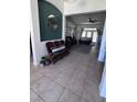 Inviting foyer with decorative tile flooring and bench seating, leading into the spacious living area at 326 Crystal Pond Ave, Deland, FL 32720