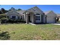 Charming single-story home with stone accents and a well-manicured lawn at 326 Crystal Pond Ave, Deland, FL 32720