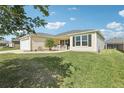 Inviting single-story home with a well-maintained lawn and classic curb appeal at 3329 Boyd Cir, Oxford, FL 34484