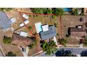 Aerial view of a single-Gathering home with a fenced backyard, including a pool and several sheds at 3415 Sail Fish Ave, Fruitland Park, FL 34731