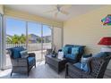 Relaxing screened in patio with ceiling fan and comfortable seating area to enjoy sunny days and cool evenings at 3756 Viscaya Ct, The Villages, FL 32163