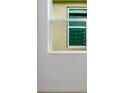 A close up shot of a double hung window at 4118 Penelope Ave, Lake Wales, FL 33859