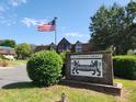 Attractive community sign showing the logo and an American flag at 500 Newell Hill Rd # D, Leesburg, FL 34748