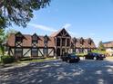 Picture of a charming building featuring a tudor-style facade and a well-kept parking lot at 500 Newell Hill Rd # D, Leesburg, FL 34748