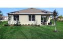 Lovely backyard featuring lush green grass and an inviting outdoor patio area at 5039 Abigail Dr, Lake Wales, FL 33859
