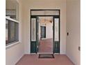 Open doorway with decorative glass and a view of the home's interior at 5941 Sage Leaf Pl, Leesburg, FL 34748