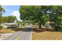 Neighborhood street view of property in established downtown community at 600 Powell St, Wildwood, FL 34785