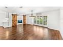 Spacious dining room featuring beautiful hardwood floors, barn doors, and natural light at 657 Riverpark Cir, Longwood, FL 32779