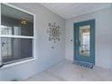 Welcoming entryway with a glass door and a view of the home's interior at 7382 Se 167Th Zina Ln, The Villages, FL 32162