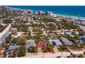 A captivating aerial view of a beachfront community, highlighting the neighborhood's proximity to the ocean at 910 Locust St, New Smyrna Beach, FL 32169