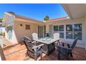 Outdoor patio featuring a cozy seating arrangement, perfect for relaxing and enjoying the serene surroundings at 910 Locust St, New Smyrna Beach, FL 32169