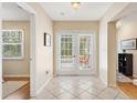 Welcoming entryway featuring tile flooring, leading to a bright and airy patio at 1037 Willow Dr, Leesburg, FL 34748