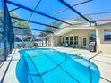 Relax in the screened-in pool area with plenty of room for entertaining and lounging at 13319 Via Roma Cir, Clermont, FL 34711