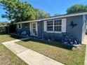 Inviting home exterior with manicured lawn, decorative accents, and ample parking space at 14657 Sw 41St Ave, Ocala, FL 34473