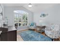 Light-filled bedroom with vaulted ceiling, shuttered windows, hardwood floors, and serene decor at 1754 Pennecamp Dr, The Villages, FL 32162