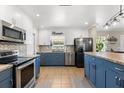 Modern kitchen showcasing stainless steel appliances, mosaic backsplash, contrasting cabinets, and ample counter space at 2252 Kent Rd, Deltona, FL 32738