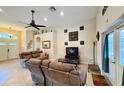 Comfortable living room with neutral tones, tile flooring, and ample natural light at 31728 Nutmeg Ave, Eustis, FL 32736