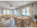 Bright living room showcasing hardwood floors, natural light, and elegant furniture at 819 Hibiscus Dr, The Villages, FL 32159