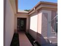 Inviting home entrance with a pathway leading to the decorative glass front door at 9593 Se 124Th Loop, Summerfield, FL 34491