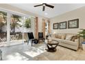 Bright living room with sliding glass doors leading to outdoor area, stylish decor and neutral color palette at 31799 Broadwater Ave, Leesburg, FL 34748