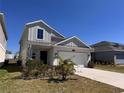 Attractive two-story home with a two-car garage and a neatly landscaped front yard at 6846 Wilson Hammock Ave, Groveland, FL 34736