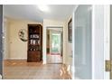 Inviting foyer with tile flooring, mirrored closet, and a glimpse of the outdoor scenery at 728 Tangerine Dr, The Villages, FL 32159