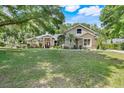 Charming single-Gathering home with stone accents, mature landscaping, and a well-manicured lawn at 10851 Lantana Crst, Clermont, FL 34711