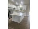 Beautiful kitchen with a center island, sleek appliances, and ample counter space at 16487 Sw 55Th, Ocala, FL 34473