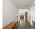 View of the tiled entryway leading to the living room and kitchen at 17238 Se 94Th Coults Cir, The Villages, FL 32162