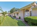 Well-manicured lawn and landscaping enhance this home's curb appeal at 236 Juniper Way, Tavares, FL 32778
