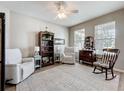 Comfortable living room featuring plush seating, neutral tones, and plenty of natural light at 2894 Southern Pines Loop, Clermont, FL 34711