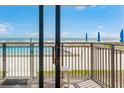 Relaxing balcony view showcasing the pool and ocean, inviting tranquility and vacation vibes from this condo at 4435 S Atlantic Ave # 114, Ponce Inlet, FL 32127