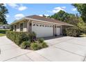 Shot of the home's driveway and multi-car garage at 5306 Greens Dr, Lady Lake, FL 32159