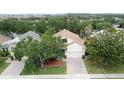 A bird's eye view of a home, highlighting its lush landscaping and location at 807 Wolf Creek St, Clermont, FL 34711