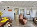 Inviting interior with dining area and a glimpse into the living space with cozy brown recliner at 10301 Us Highway 27 # 63, Clermont, FL 34711