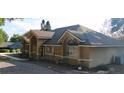 Side view of a well-maintained single story home with a landscaped yard at 10640 Parkway Dr, Clermont, FL 34711