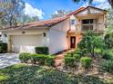 Charming two-story home features a two-car garage, balcony and beautiful landscaping at 1164 E Winged Foot Cir, Winter Springs, FL 32708