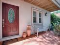 Inviting front porch with seating and decor, creating a warm and welcoming entrance at 1164 E Winged Foot Cir, Winter Springs, FL 32708