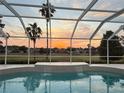 Sunset view from the screened-in pool at 2706 Radbourne Way, The Villages, FL 32162