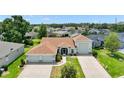 Wide aerial view of the home showcasing its premium lot, manicured lawn and landscaping at 4320 Heritage Trl, Leesburg, FL 34748