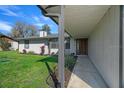 Inviting front porch with a walkway to a decorative front door and well-maintained landscaping at 5011 Se 33Rd Ave, Ocala, FL 34480