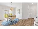 Bright dining area with a round table, stylish chairs, and sliding glass door at 6471 Ecoff Pl, The Villages, FL 34762